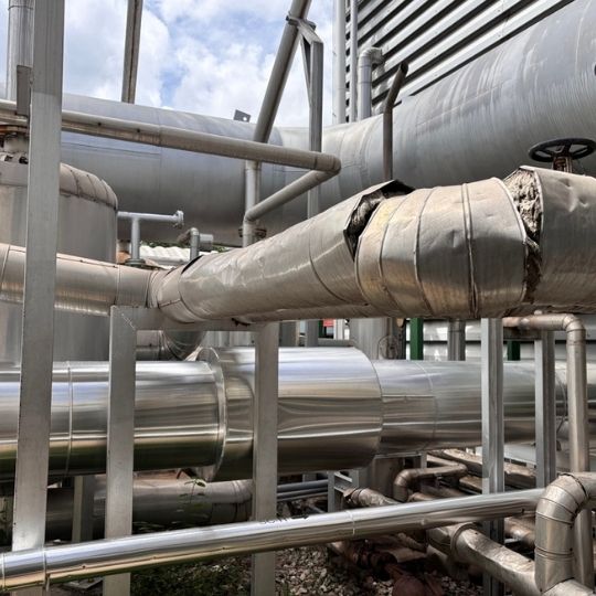 Damaged Piping and Insulation Showing During An External Roof Inspection Damaged Piping and Insulation Showing During An External Roof Inspection